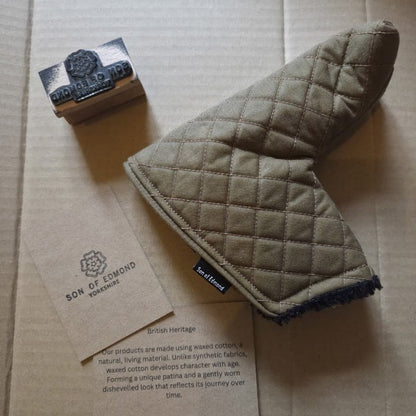 Tan Quilted waxed putter cover with black sherpa lining